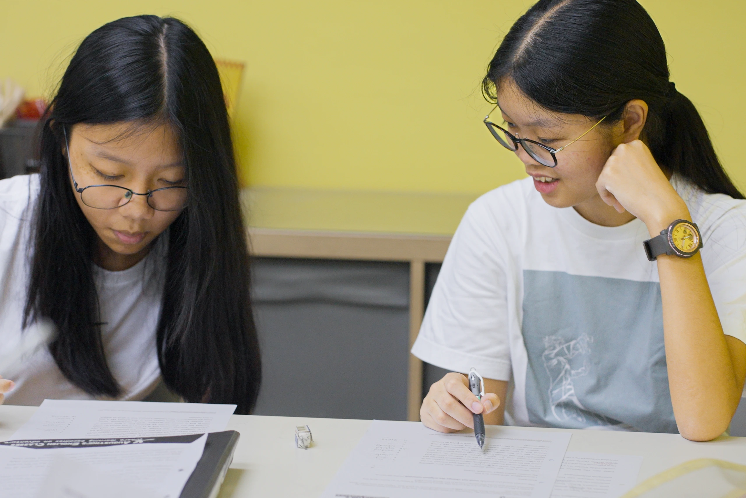 Junior College students engaged in A Level General Paper tuition practice with collaborative learning at Augustine English Classes Singapore